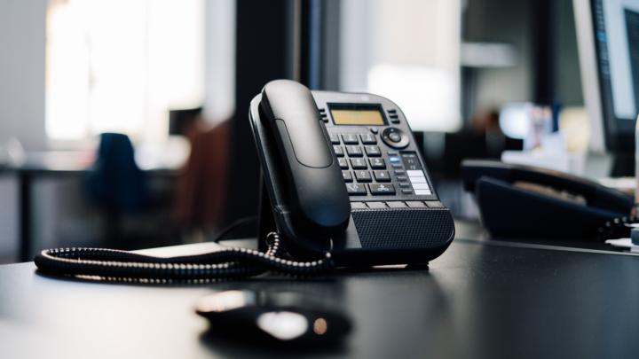 Black telephone on a desk