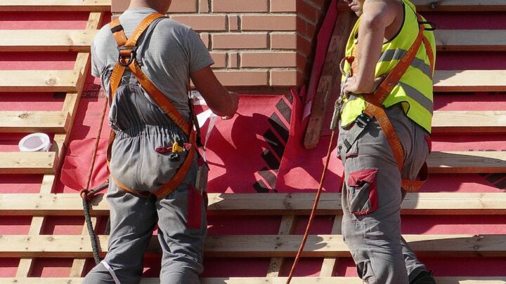 workers renovating a roof