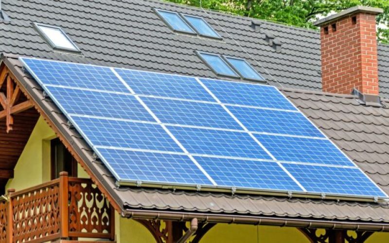 solar panels on yellow house