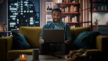 Person looking at screen in his flat