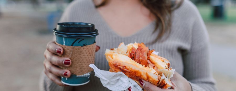 food contact materials: holding a coffee cup and burger