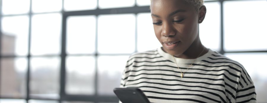 young lady holding her phone