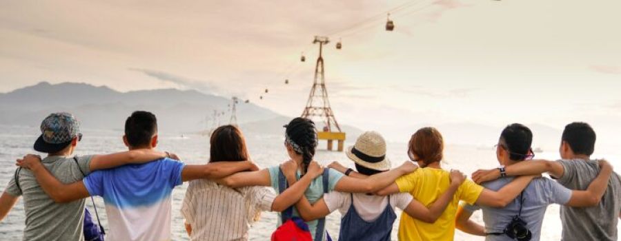 group of friends looking at the sea