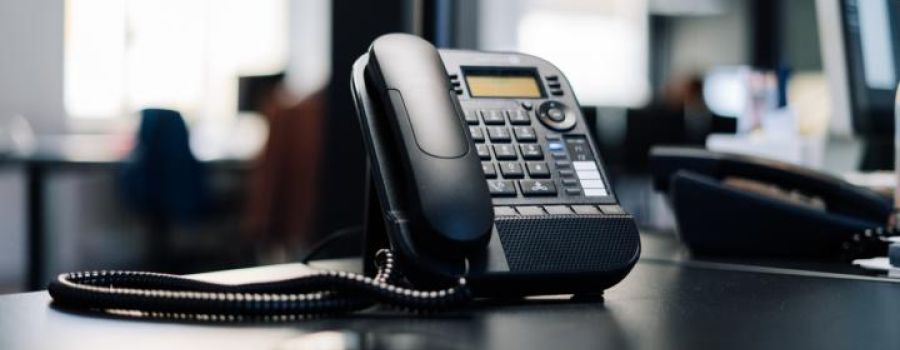 Black telephone on a desk